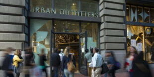 Pedestrians walk by an Urban Outfitters Inc. store in San Francisco, California, U.S., on Friday, Aug. 15, 2014. Urban Outfitters Inc. is scheduled to release earnings figures on Aug. 18. Photographer: David Paul Morris/Bloomberg